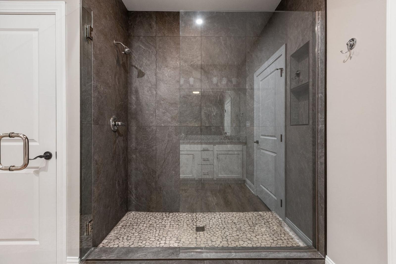Stone Addition primary suite tile shower
